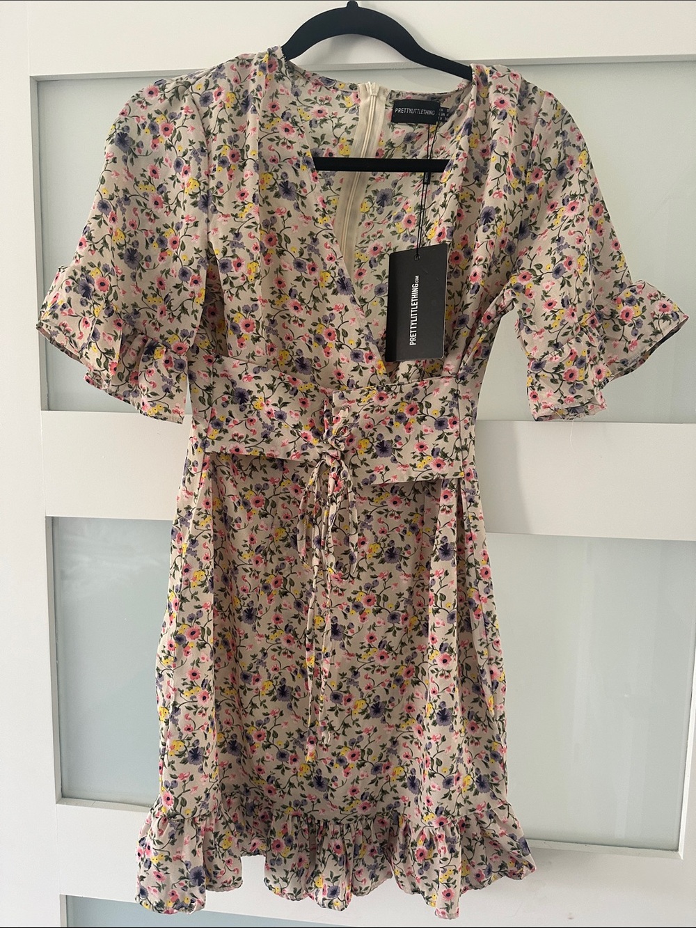 PrettyLittleThing Cream Floral Ruffle Wrap Mini Dress